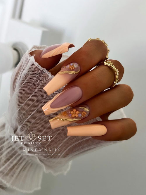 Long coffin peach nails mixing French tip nails and French ombre nails that adorned with flowers and gold chrome decorations