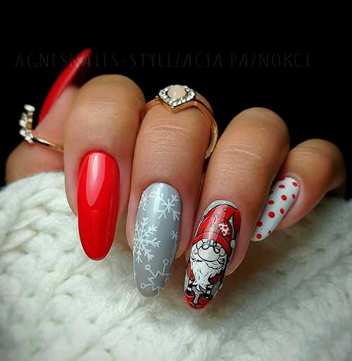 Cute long almond red Christmas nails with Santa nail, snowflakes nail, and polka dot nail design!