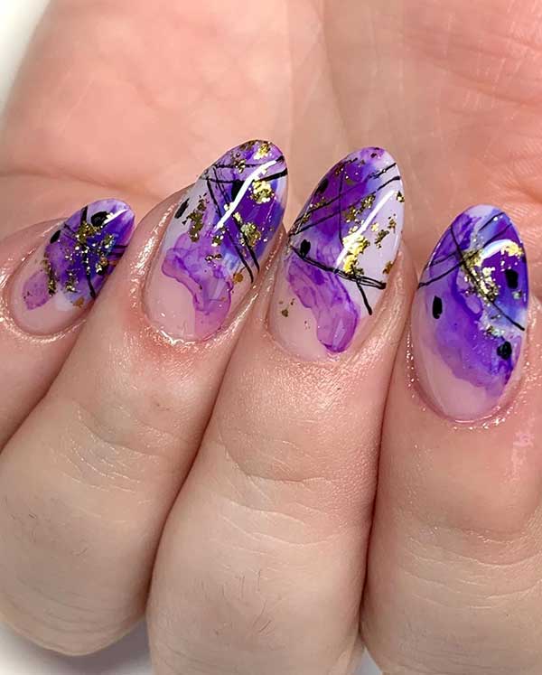 Purple marble almond shaped with black curved line nail art design with gold foil for spring 2020