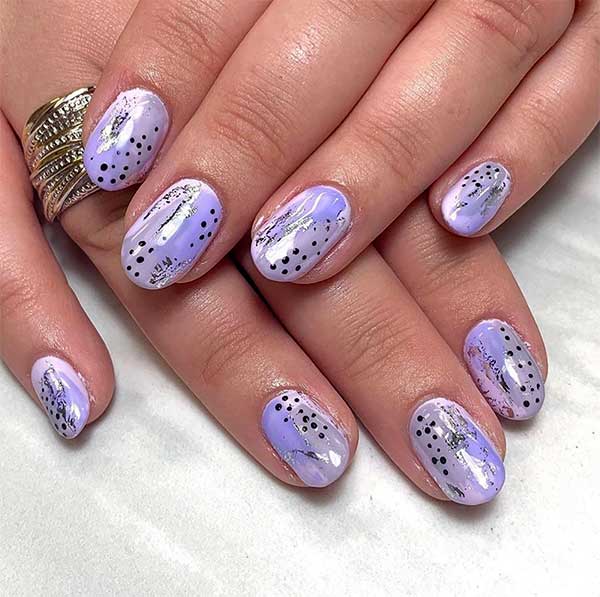 So vibrant round nails colors with glowing ombre purple effect and some black dots for spring 2020