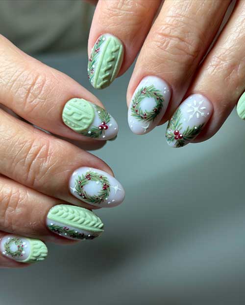 Christmas sweater-inspired almond nails showcasing French art, snowflakes, and wreaths over a milky white base.