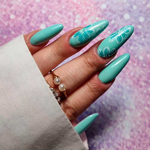 Dusty aqua nails with two accent flower nails design