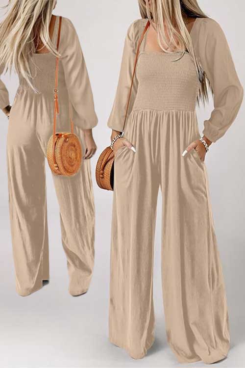 Solid color women's casual loose overalls with long sleeves, wide legs, and pockets, perfect for relaxed outings.