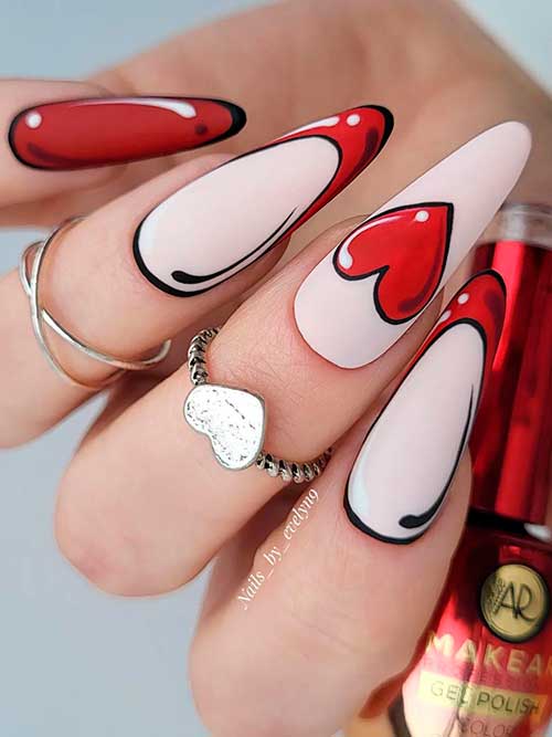 Valentines pop art nails with two French accent nails and a big red heart shape on the middle fingernail