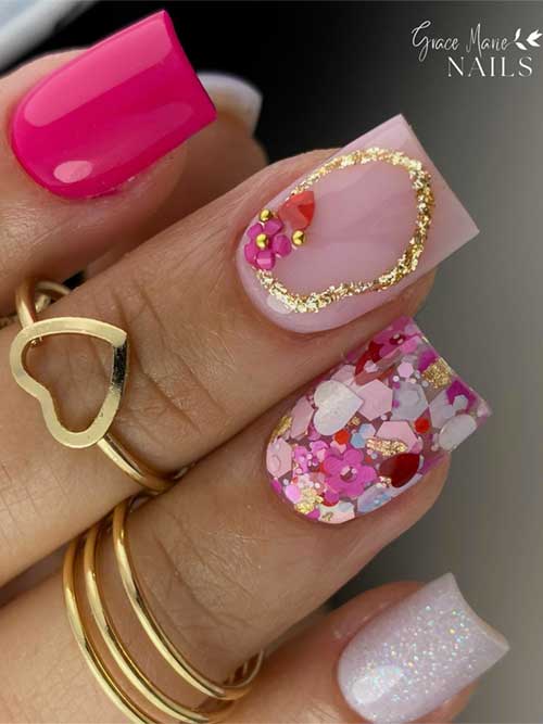 Medium squared pink and nude Valentine nails adorned with rhinestones, glitter, and heart-shaped accents.