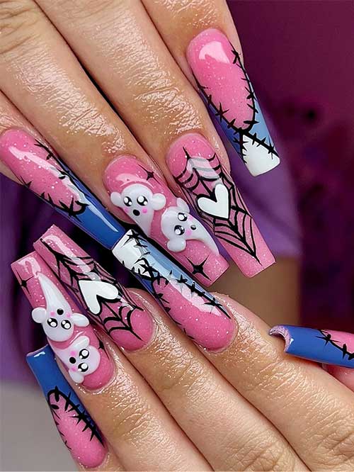 Long pink Halloween coffin nails featuring glitter, blue French tips, stitch art, white hearts, and ghost designs.