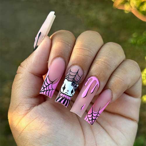 Nude nails featuring pink French tips, Hello Kitty clown art, spider web designs, and colorful drip accents.