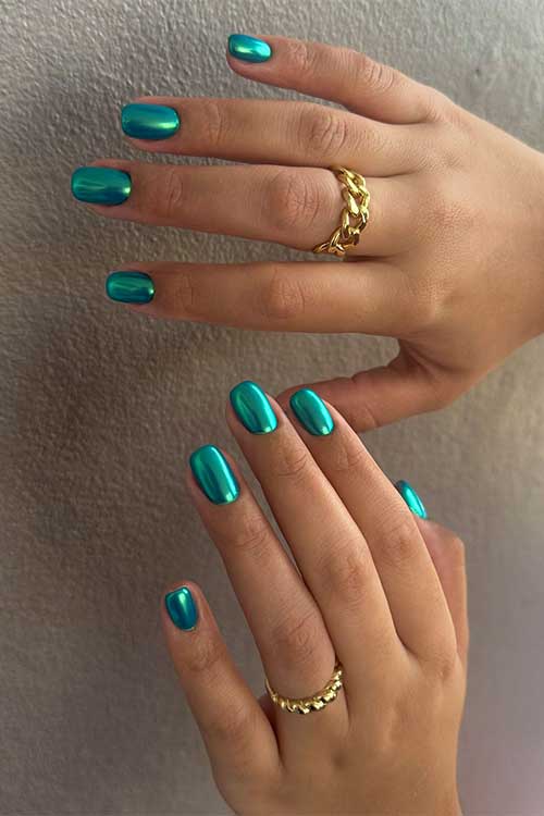 Short chrome green nails designed for fall, showcasing a sleek and stylish appearance.