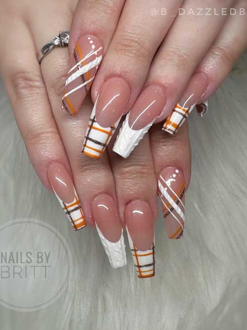 Long coffin-shaped white French nails on a nude base, featuring burnt orange and glitter brown plaid prints, plus a white tip accent.