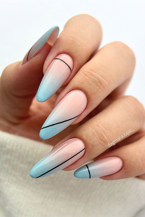 Long baby blue ombre nails almond shaped with black line nail art