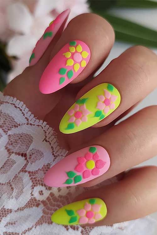 Long Almond Pink and Yellow Neon Nails with Prominent Flowers