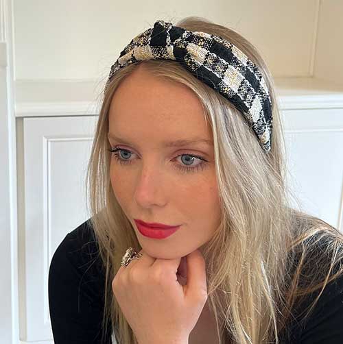 A knotted headband designed for comfortable and stylish cozy hairstyles, perfect for everyday wear.