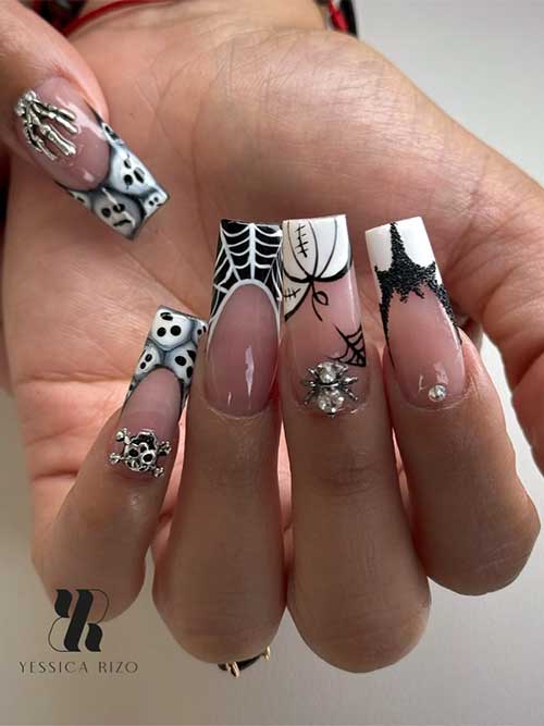 Black and white coffin-shaped Halloween nails with French tips, adorned with spooky motifs and silver rhinestones.