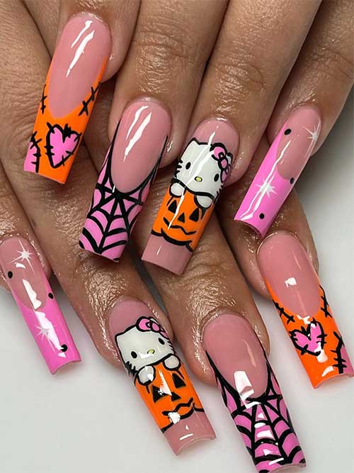 Cute pink and orange Halloween nails featuring Hello Kitty, pumpkins, stitched designs, and spider web art.