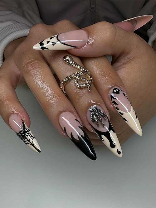 Light beige and black Halloween French nails with drip art, cobwebs, pumpkins, and black bat tips for a festive look.