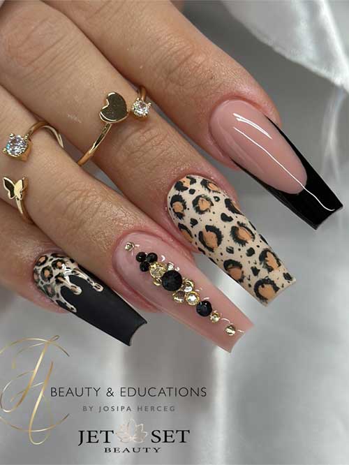 Elegant black coffin nails with black French tips, nude accents adorned with rhinestones, and leopard print on a matte beige base.