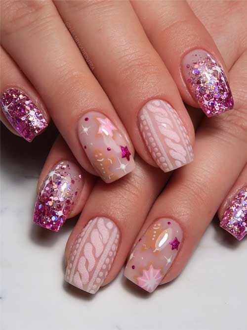 Festive pink glitter winter nails featuring a nude pink sweater design and gingerbread star nail art.