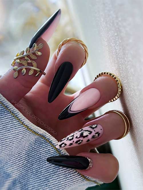 Long black stiletto nails featuring leopard print and French tip accents for a bold and stylish manicure.