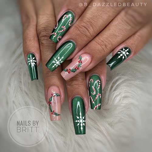 Dark green Christmas nails adorned with cat eye art, holly, snowflakes, and candy cane designs for a festive look.