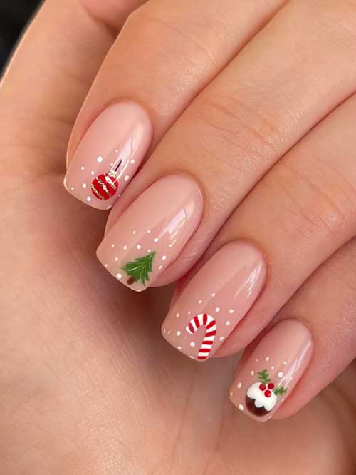 Simple nude Christmas nails featuring festive designs of Christmas balls, trees, holly, and candy canes.