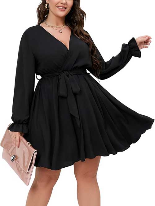 Women's plus size dress with long sleeves, a stylish wrap design, V-neckline, and a tie waist for an elegant look.