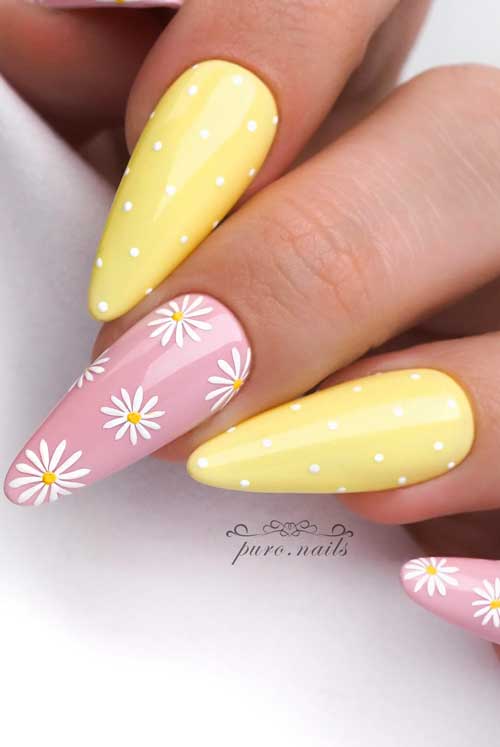 Spring-inspired nail art with pastel yellow and light pink nails, featuring polka dots and daisy flowers for a playful touch.